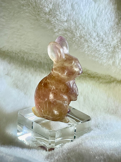 Rabbit carved in Fluorite with golden and pink hues
